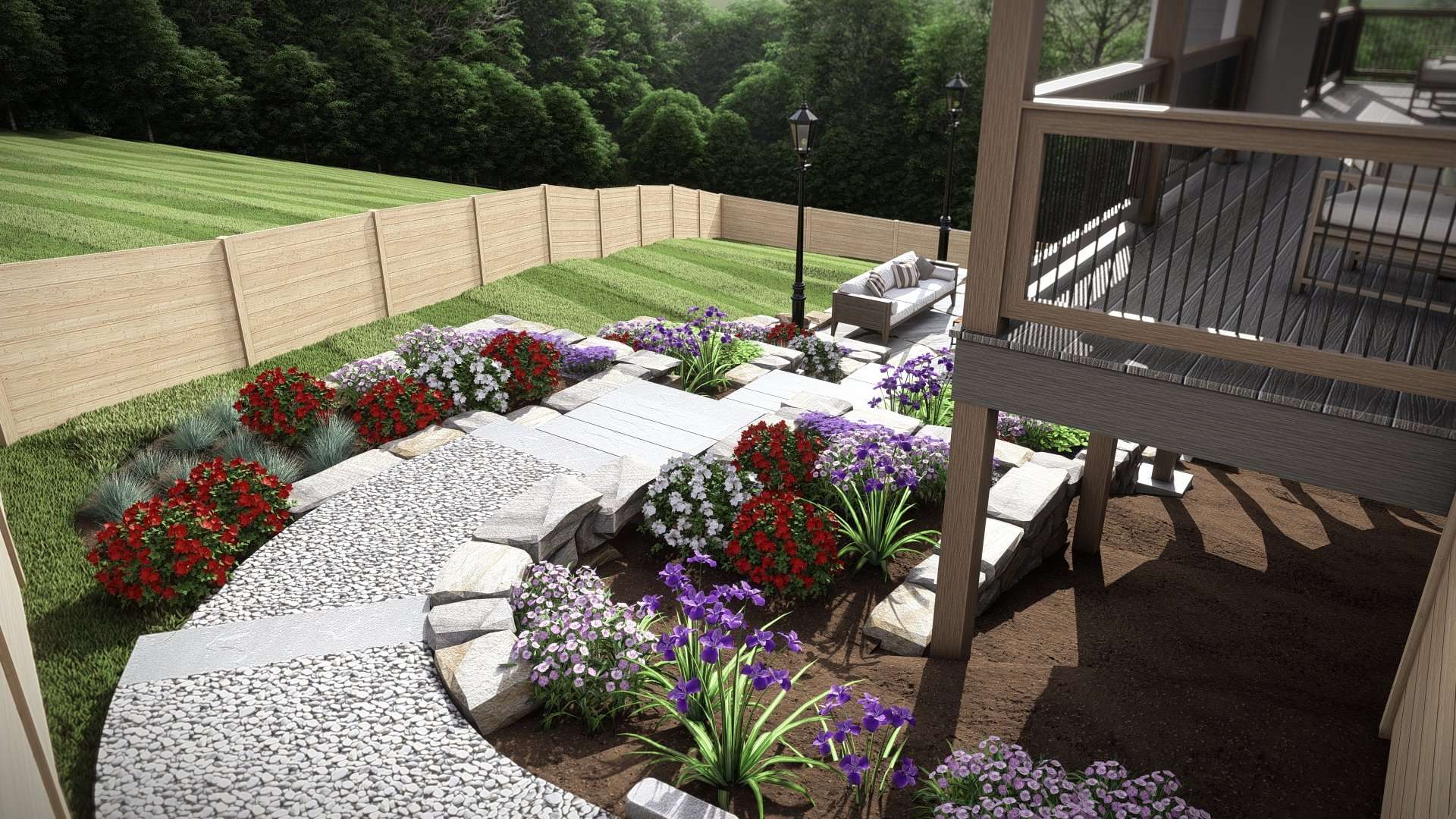 Beautifully designed backyard landscape featuring a mix of colorful flowers, stone pathways, and wooden fencing, showcasing expert landscape design in Etowah, NC for creating inviting outdoor spaces.